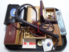 A tray containing polished stones, travel games, playing cards, riding whip, trinket boxes etc.