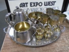 A silver plated tray together with further plated wares including a four-piece tea service, goblet,