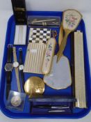 A tray of dressing table items, universal slide rule, commemorative coin, wristwatches,