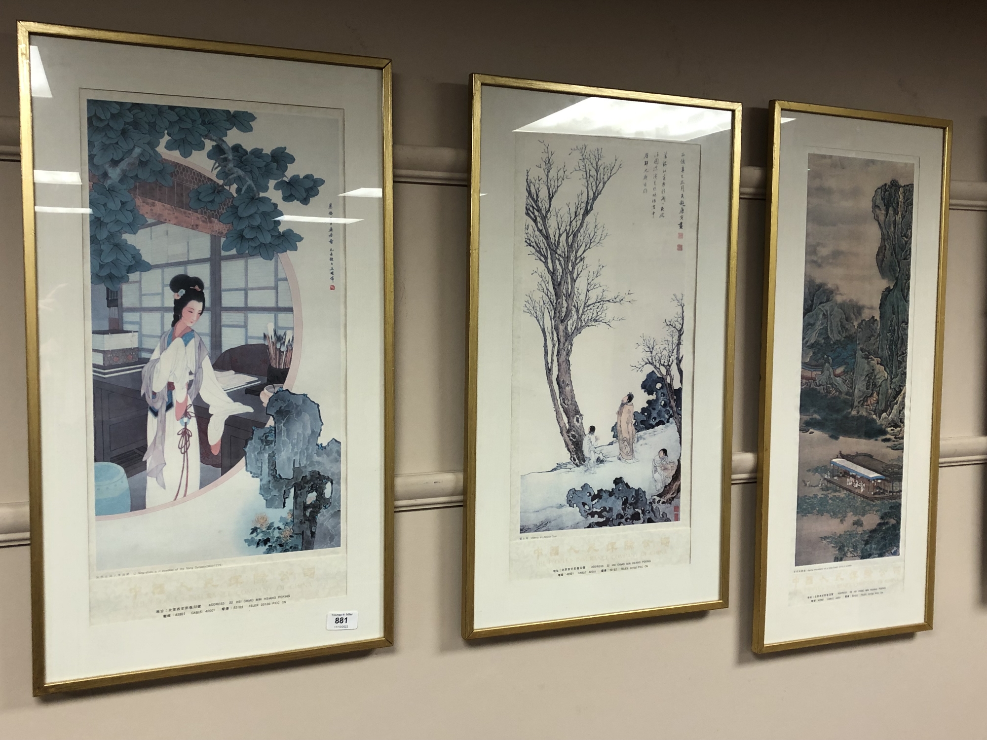 Three Chinese colour prints depicting figures and landscapes, two 41cm by 71cm and one 34cm by 80cm.