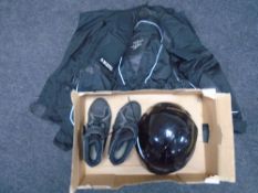 A box of motorcycle clothing and helmet