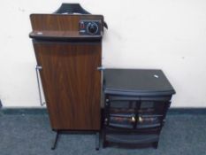 A Corby trouser press together with a coal effect electric fire.