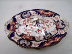 An antique Imari pattern scallop edge dish with Royal Crown Derby lid.