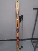 A pair of children's Syntro S20 Volki skis with ski poles.