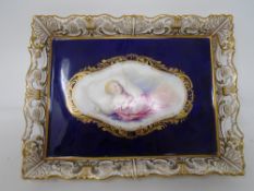 An early 19th century china dish with gallery depicting a sleeping child.