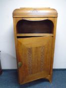 A continental carved oak Art Deco cabinet.