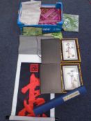 A box containing Oriental silk pictures and scroll, Oriental fabrics etc.