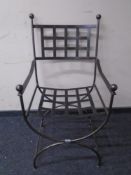 A wrought iron armchair