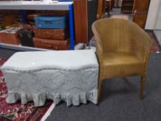 A golden loom basket chair and blanket box