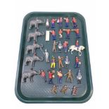 A tray containing mid-20th century painted lead military figures, bandsmen, figures on elephants.
