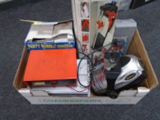 A box containing a tile cutter, a bubble machine, a soldering kit, a light splash,
