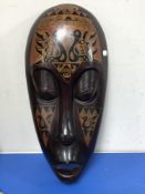 An African carved wooden head plaque.