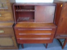 A mid-20th century teak bureau.