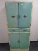 A mid-20th century painted kitchen cabinet.