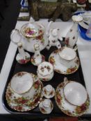 A tray of Royal Albert Old Country Roses tea china including teapot, teddy bear ornament,