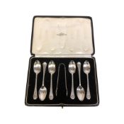A set of six silver teaspoons and sugar tongs, London 1930, boxed.