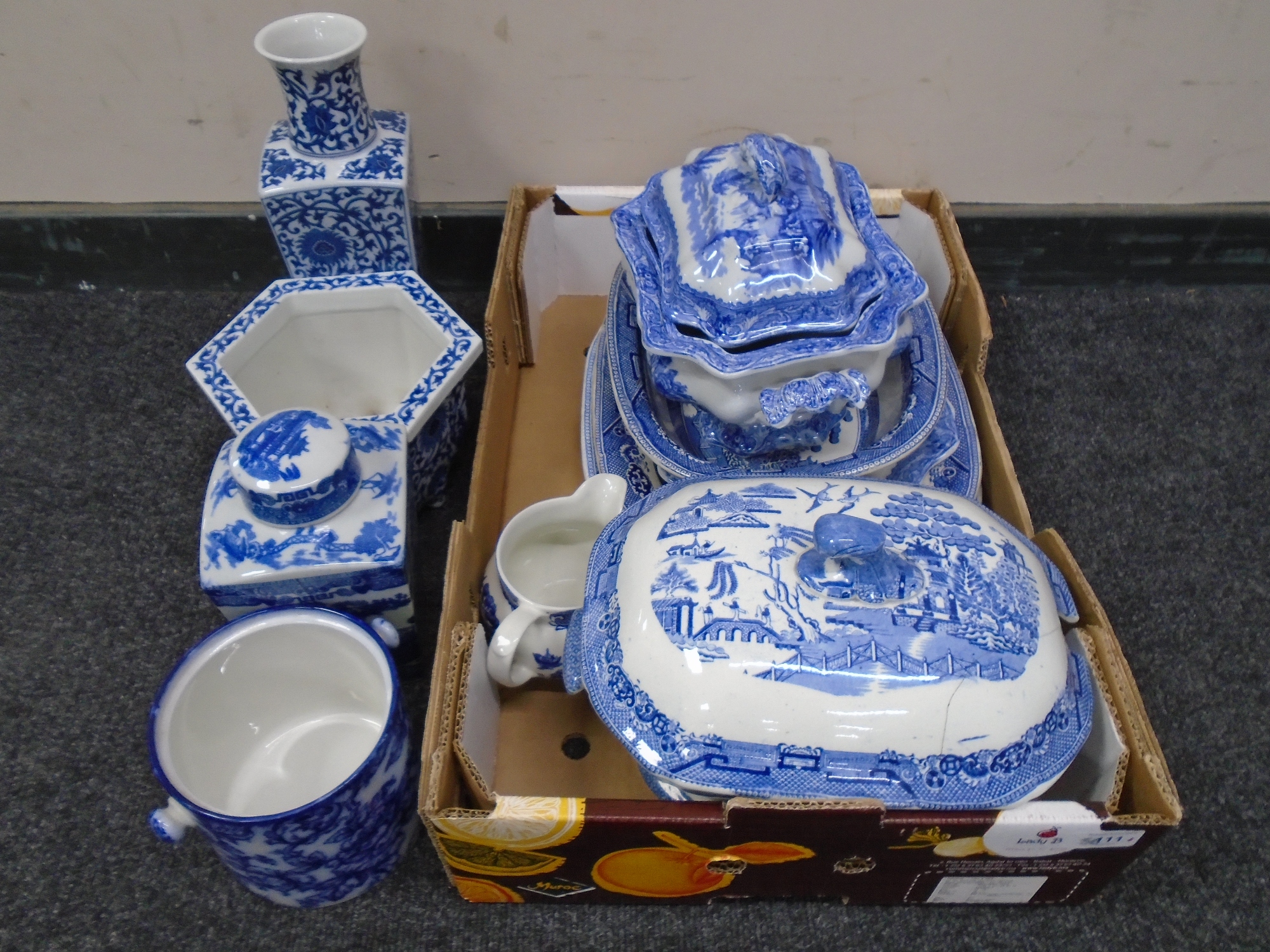 A collection of blue and white china, tureens, plates, antique willow pattern items,