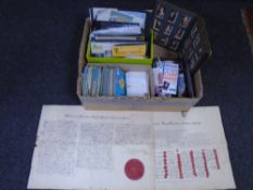 A box of postcards, loose stamps, cigarette card album.