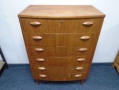 A mid-century Danish teak bow-fronted six drawer chest