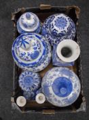 A box of blue and white urns, vases etc.