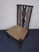 An Edwardian beech rush seated bedroom chair.