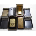 Six lighters in cases and pouches including Zippo, Dunhill, Ronson.