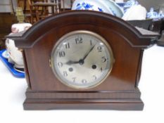 An Edwardian mahogany mantel clock.