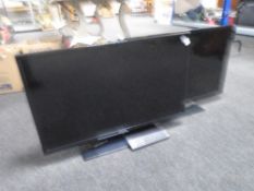 A Samsung 32" LCD TV with remote together with a further E-Motion 32" TV.