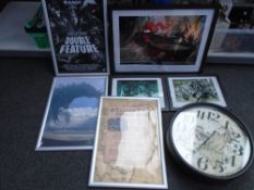 A large reproduction wall clock together with Dungeons & Dragons pictures and posters.