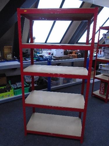 A five tier red metal shelving unit.