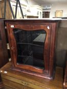 An early 20th century mahogany wall mounted display cabinet.