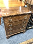 A George III style mahogany four drawer gentleman's chest with slide.