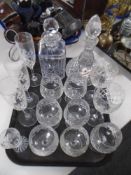 A tray containing assorted glassware including lead crystal decanters and assorted drinking glasses.