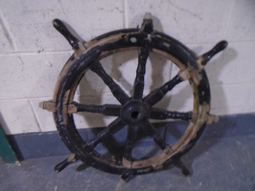 A wooden ships wheel.