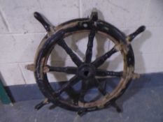 A wooden ships wheel.