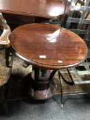 A mahogany Art Deco style circular occasional table.