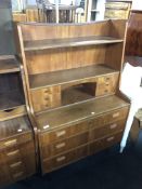 A mid-20th century Danish teak secretaire chest fitted with drawers and shelves above.