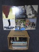A box containing vinyl records including Motorhead, Wishbone Ash, New Order, Lou Reed, Tindersticks,