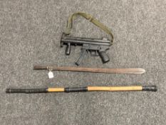 A replica MP5 machine gun together with an antique spear head and a bamboo cane (3)