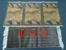 A machine made Eastern fringed rug together with a contemporary rug with deer decoration.