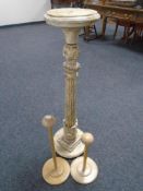 An antique painted plant pedestal together with two hat stands.