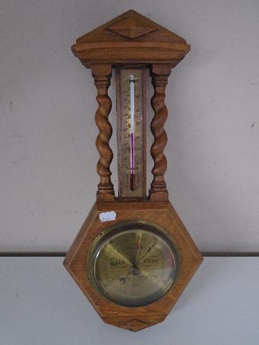 An oak barometer thermometer