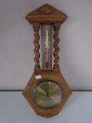 An oak barometer thermometer