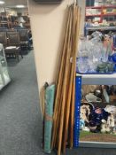 A large quantity of snooker cues,