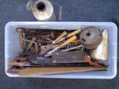 A large box of tools, saws and a Volcano kettle.