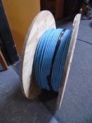 A spool of blue fibre optic cable.