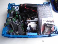 A crate containing guitar accessories, acoustic guitar strings and caps etc.