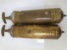 Two vintage Pyrene brass fire extinguishers.