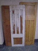 Three antique pine interior panel doors.