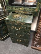 A Japanese green lacquered three drawer chest.